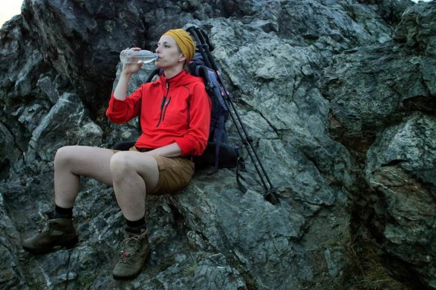Hiker drinking from water bottle Panther Lake Camping Resort