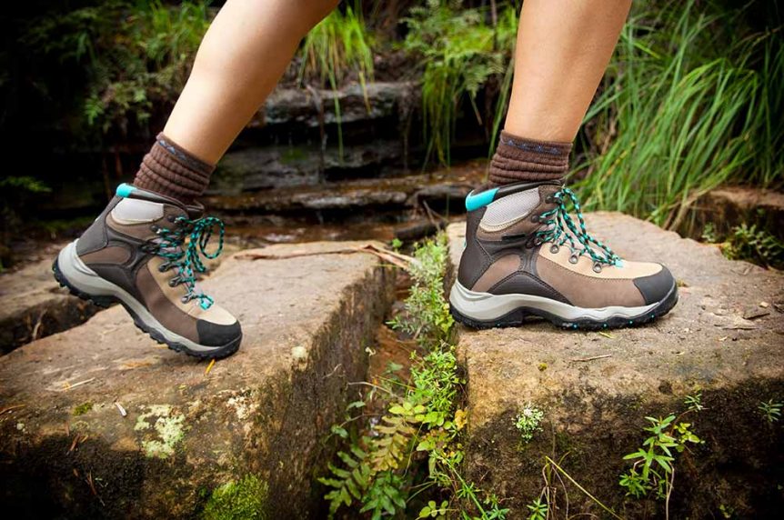 Hiking shoes walking on trail