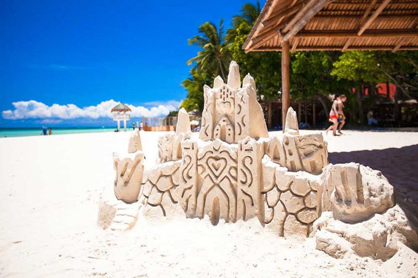 Sandcastle on tropical beach